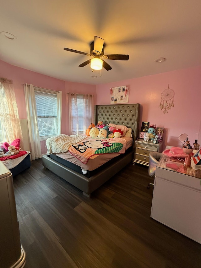 bedroom with ceiling fan and wood finished floors