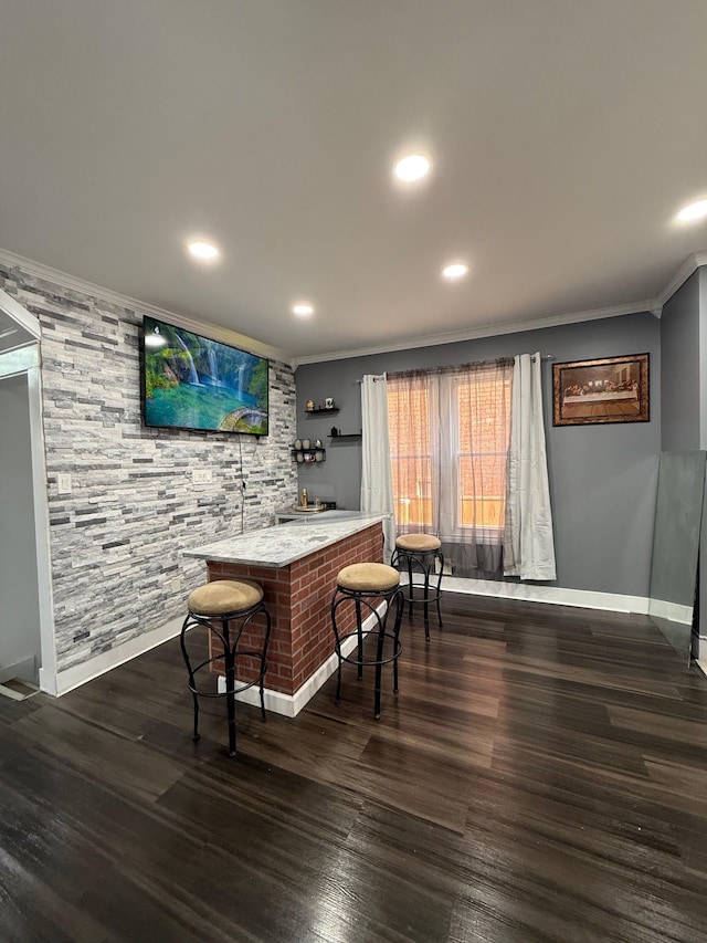 bar featuring recessed lighting, baseboards, wood finished floors, and ornamental molding