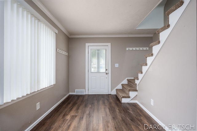 entryway with visible vents, stairs, baseboards, and wood finished floors