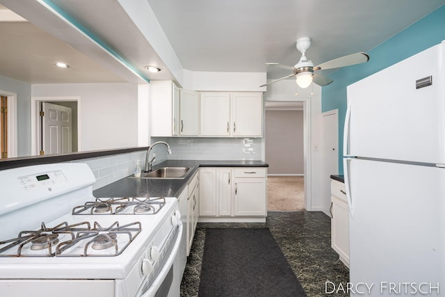 kitchen with white appliances, a sink, white cabinets, dark countertops, and backsplash