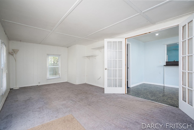 empty room with carpet and french doors