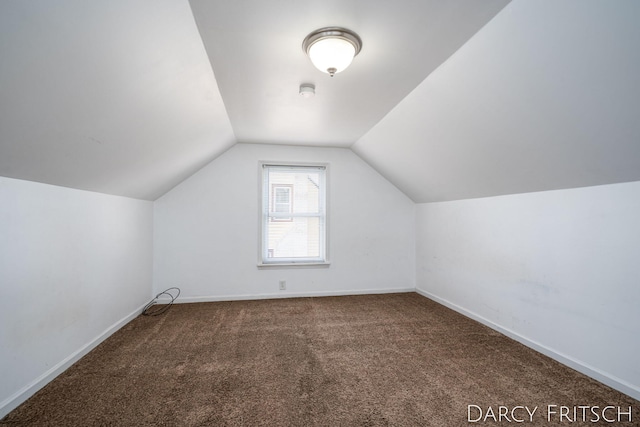 bonus room featuring baseboards, lofted ceiling, and carpet