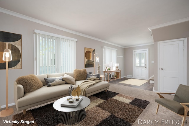 living area with visible vents, baseboards, and ornamental molding