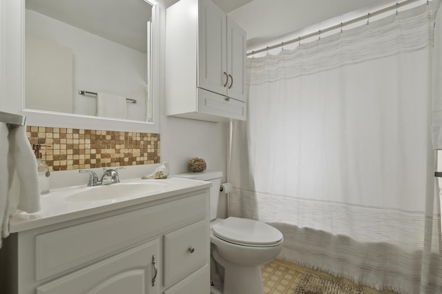 bathroom featuring tasteful backsplash, a shower with shower curtain, toilet, and vanity