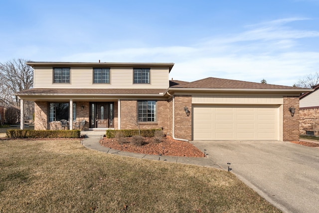 traditional-style home featuring driveway, a porch, a front lawn, a garage, and brick siding