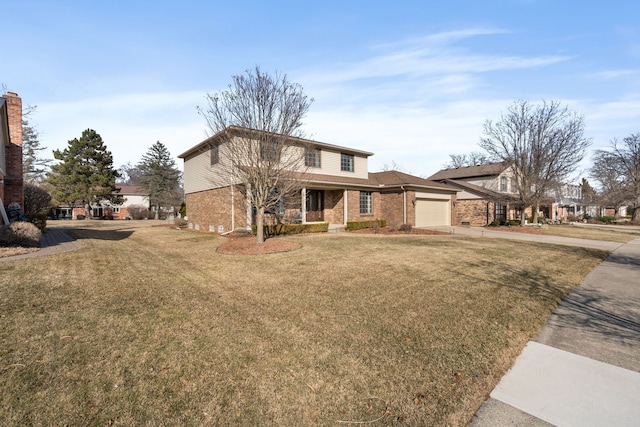 view of front of property featuring a front lawn, an attached garage, brick siding, and driveway