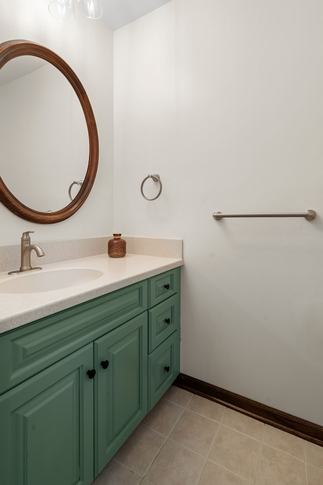 bathroom featuring vanity, tile patterned floors, and baseboards