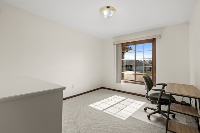 office space with baseboards and carpet floors