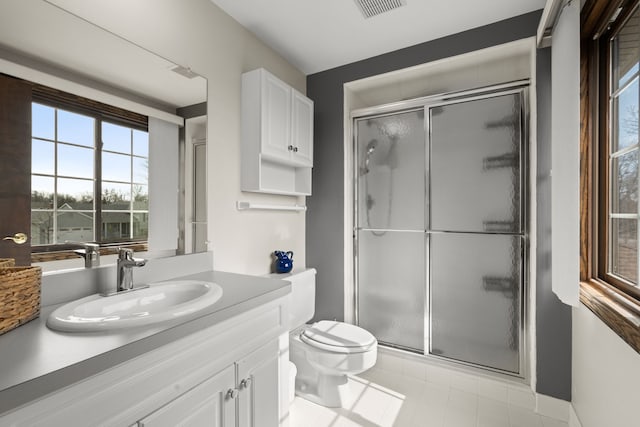 full bath featuring visible vents, toilet, a stall shower, and vanity