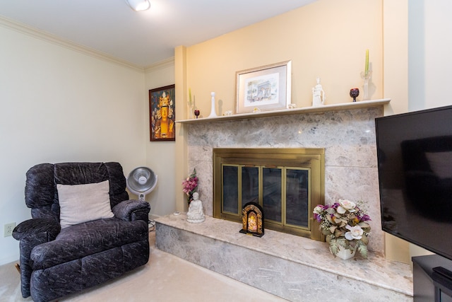 sitting room featuring a premium fireplace and ornamental molding