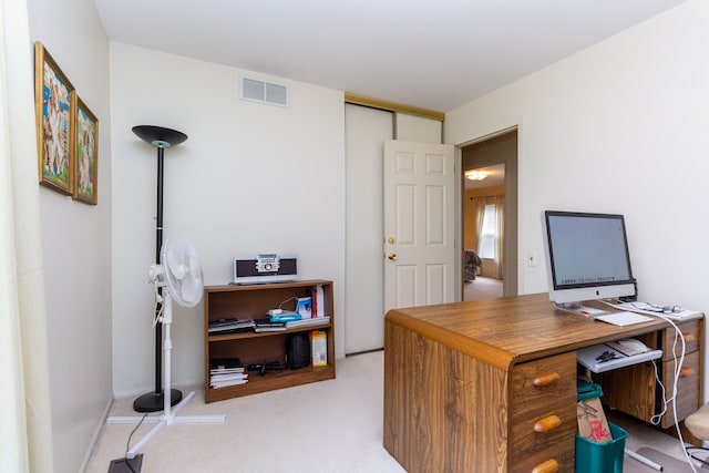 home office with visible vents and carpet flooring