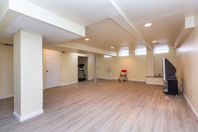 below grade area featuring recessed lighting, baseboards, and light wood-style floors