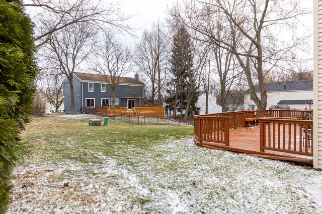 view of yard featuring a wooden deck and fence