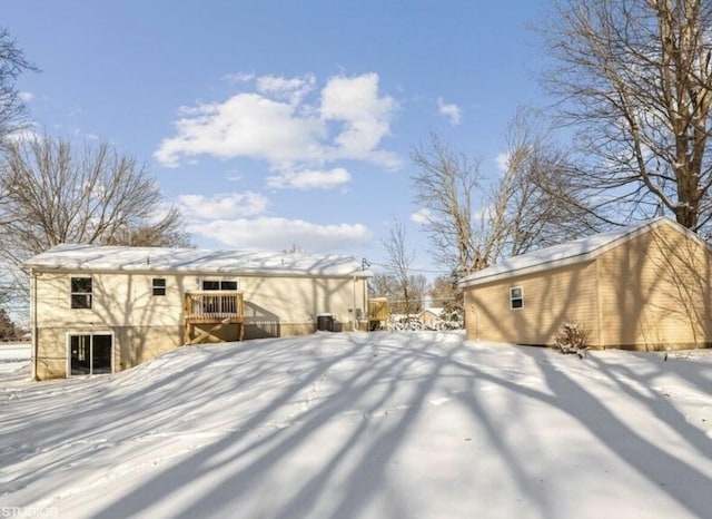 snowy yard featuring a deck