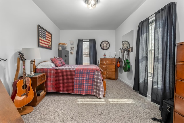 bedroom featuring carpet flooring and baseboards