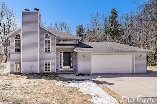 view of front of house with a shingled roof, a garage, driveway, and a chimney