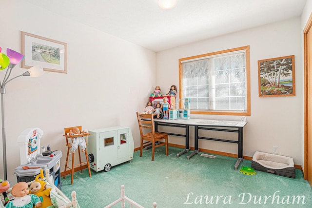 office with baseboards and carpet floors