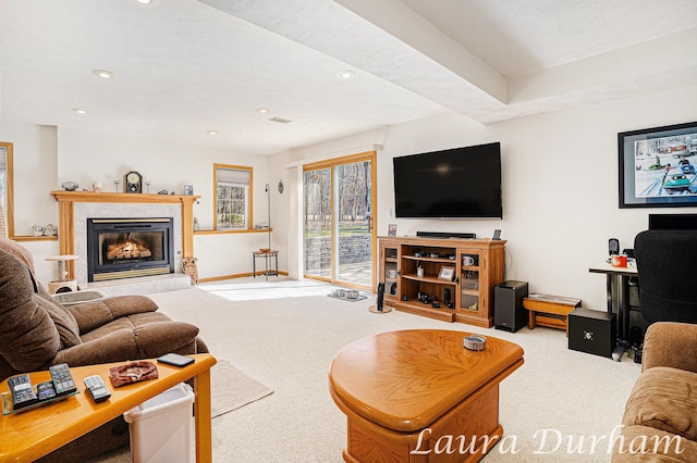 living area with a tiled fireplace, carpet flooring, recessed lighting, and baseboards