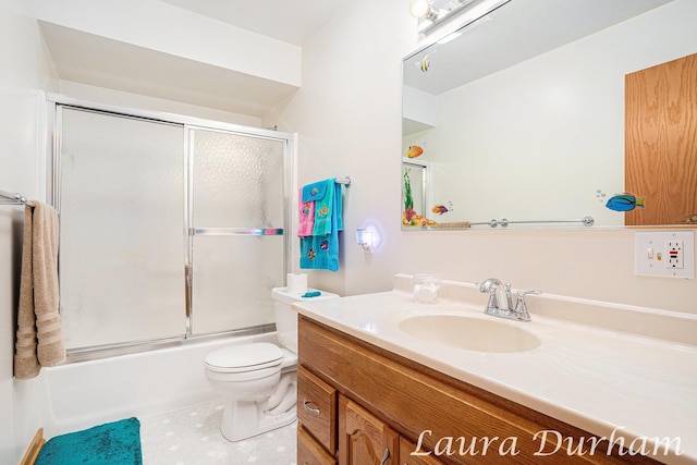 full bathroom featuring vanity, toilet, and combined bath / shower with glass door