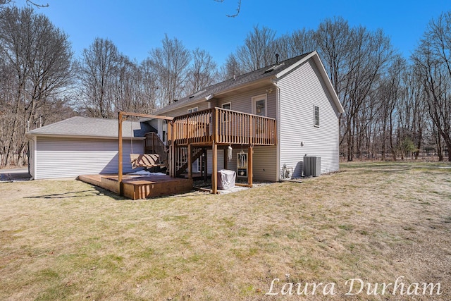 rear view of property featuring a wooden deck, a yard, central AC, and stairway