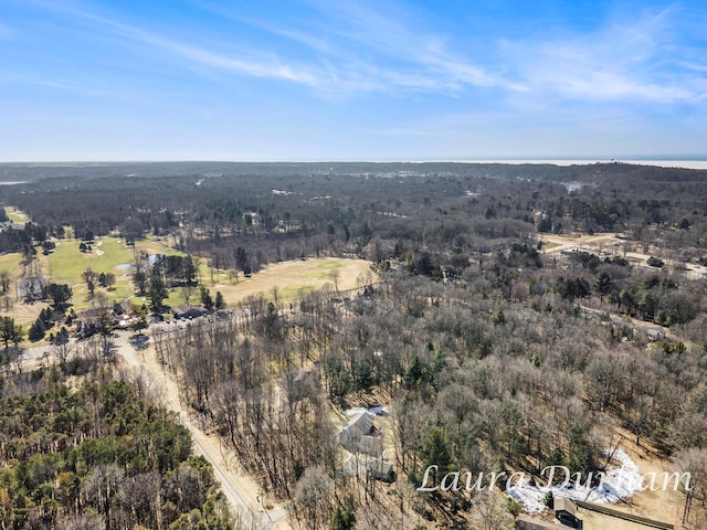 bird's eye view featuring a wooded view