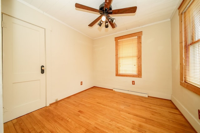 unfurnished room with crown molding, light wood-style flooring, a ceiling fan, and a baseboard radiator