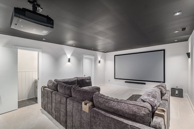 carpeted home theater featuring visible vents