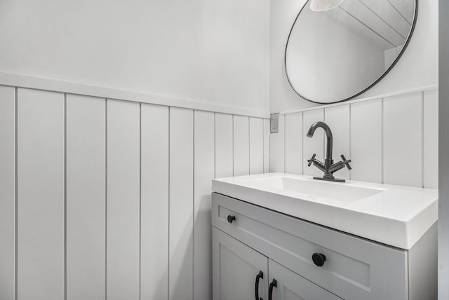 bathroom with vanity and wainscoting