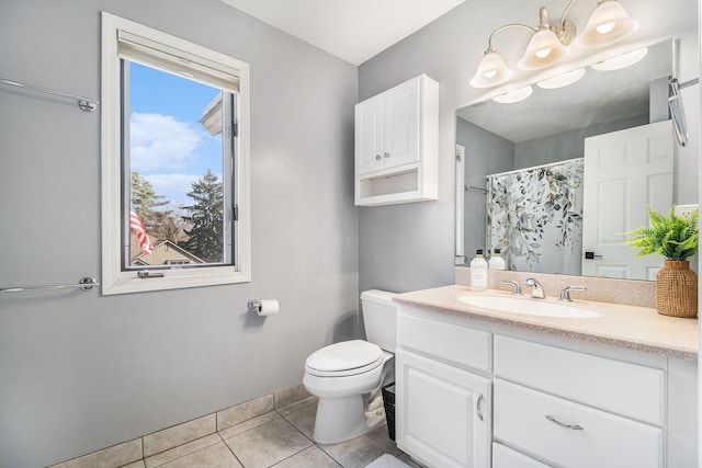 bathroom featuring tile patterned flooring, toilet, vanity, and a shower with curtain