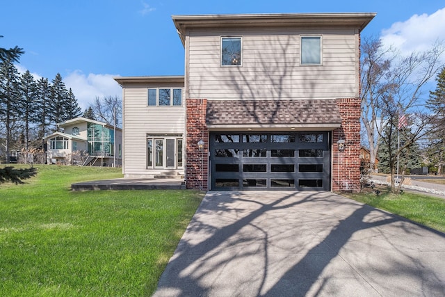 view of front of property featuring an attached garage, concrete driveway, and a front yard