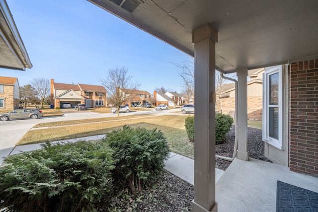 view of patio with a porch, visible vents, and a residential view