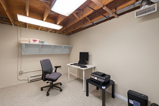 carpeted office space featuring visible vents, baseboard heating, and baseboards