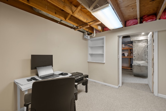 home office featuring baseboards and light colored carpet