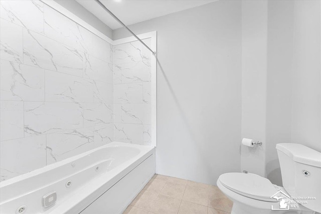 bathroom featuring tile patterned floors, toilet, and a combined bath / shower with jetted tub