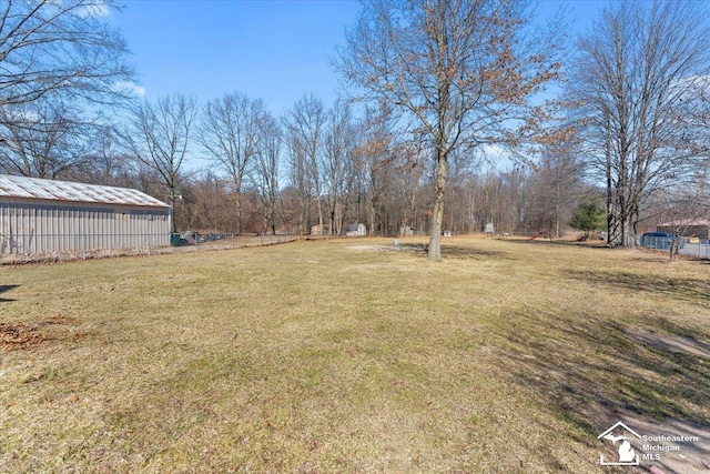 view of yard featuring an outbuilding and a pole building