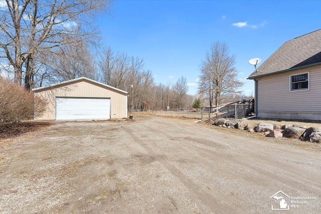 exterior space with an outbuilding and a garage