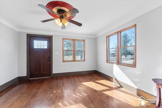 foyer entrance with hardwood / wood-style flooring, visible vents, baseboards, and ceiling fan