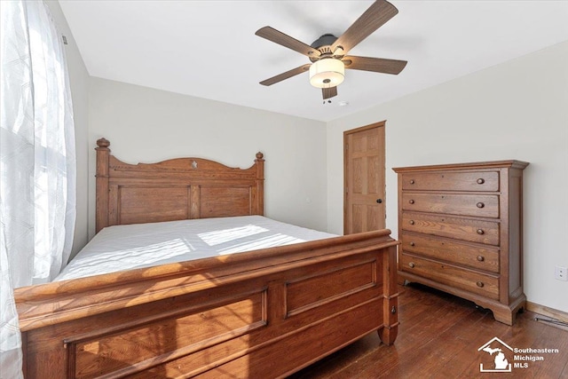 bedroom with dark wood-type flooring and ceiling fan