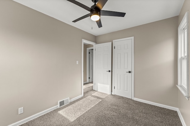 19124 Harman St, Melvindale, MI 48122 - unfurnished bedroom featuring visible vents, light colored carpet, baseboards, and ceiling fan