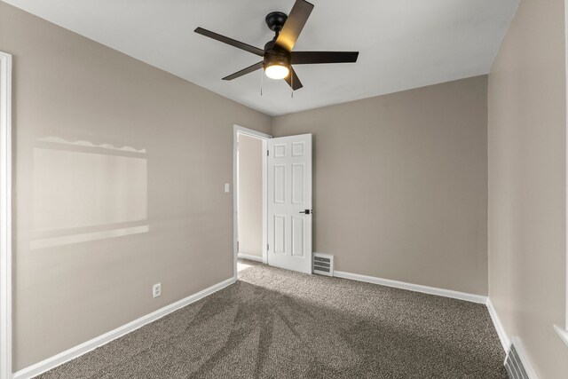 19124 Harman St, Melvindale, MI 48122 - carpeted spare room with visible vents, a ceiling fan, and baseboards