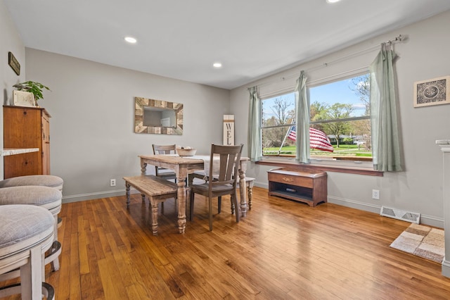 dining area featuring recessed lighting, baseboards, light wood finished floors, and visible vents