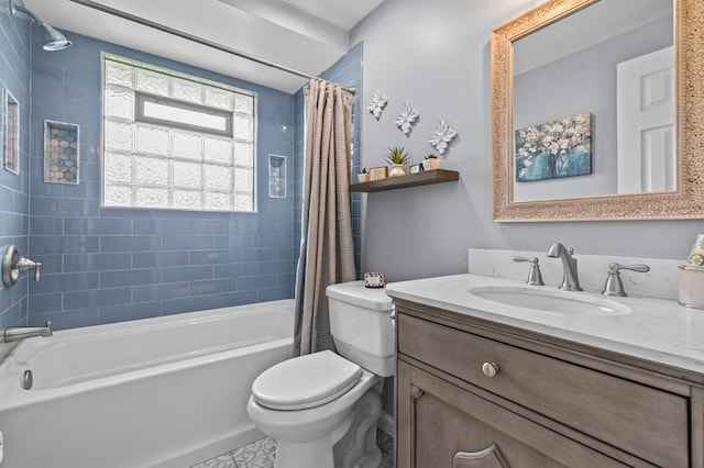 full bath featuring shower / bath combo with shower curtain, toilet, and vanity