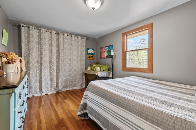 bedroom with wood finished floors