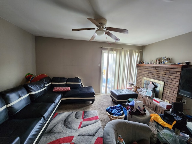 carpeted living room with a brick fireplace and ceiling fan