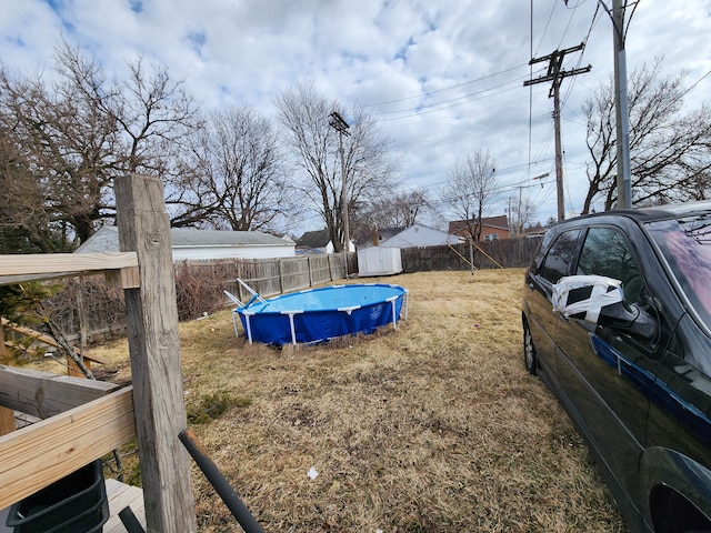 view of yard with a fenced in pool and a fenced backyard