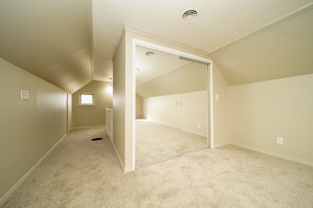 bonus room featuring visible vents, carpet flooring, baseboards, and lofted ceiling