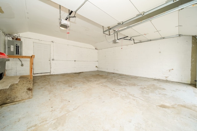 garage featuring electric panel and a garage door opener