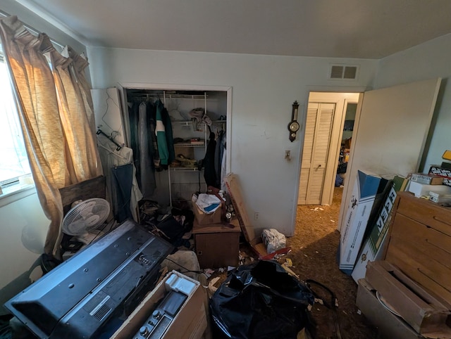 bedroom with visible vents and a closet