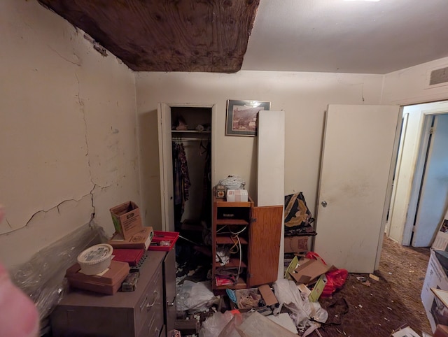 bedroom with a closet and visible vents