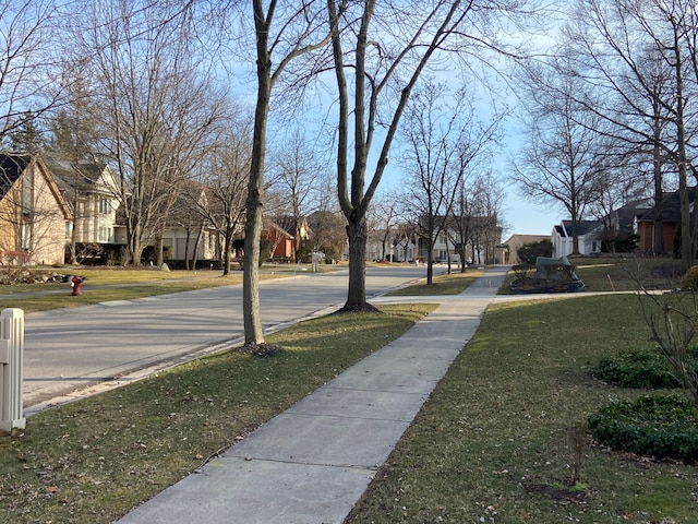 view of road featuring a residential view and sidewalks